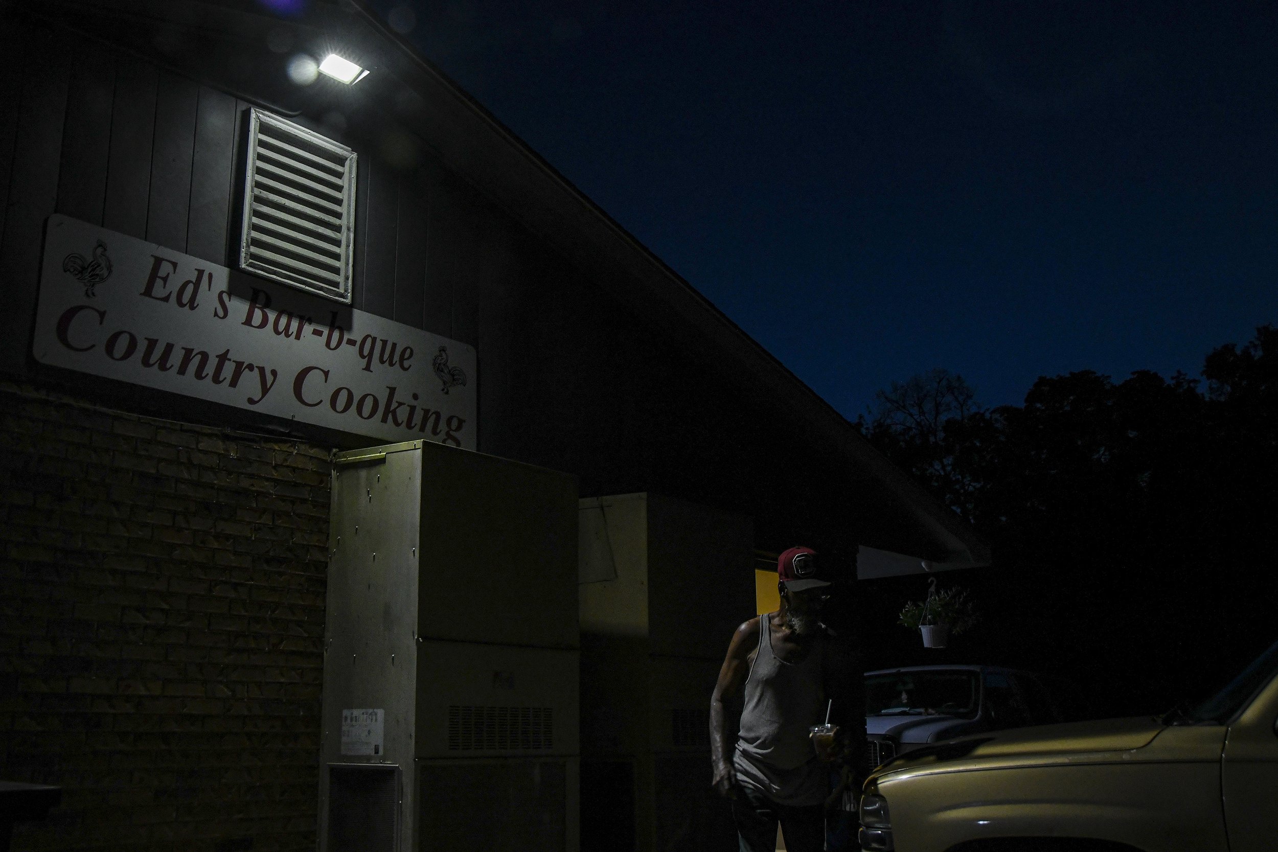  A customer leaves Ed’s Bar-b-que in Phenix City, Ala., Oct. 9, 2021. The restaurant is where Cedric Jamal Mifflin was stopped by Michael Seavers, a Phenix City police officer before Seavers shot at Mifflin 15 times, killing Mifflin, a young unarmed 