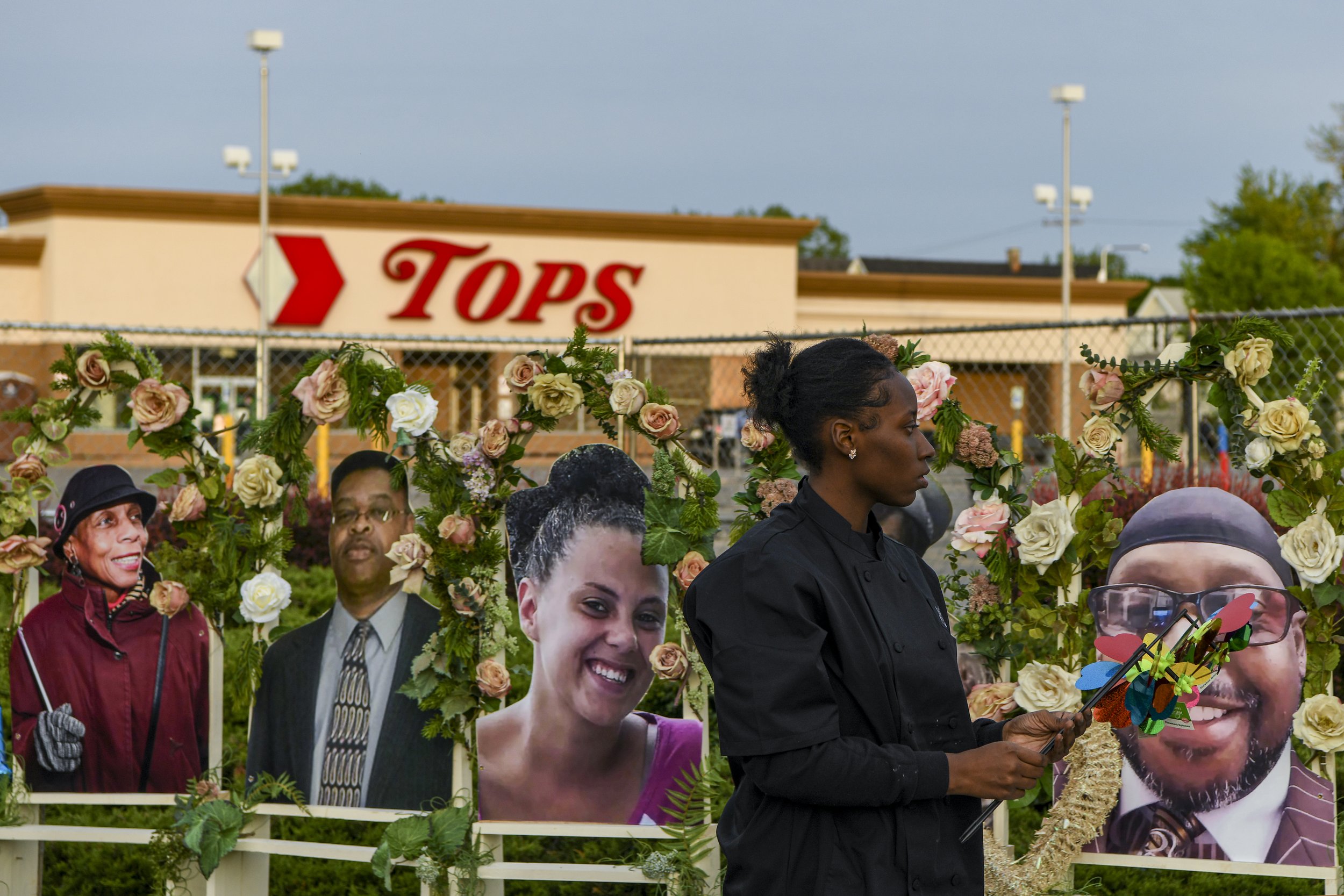  Large images depicting those who were killed during the mass shooting have been added to the memorial site outside the Tops Friendly Market. 