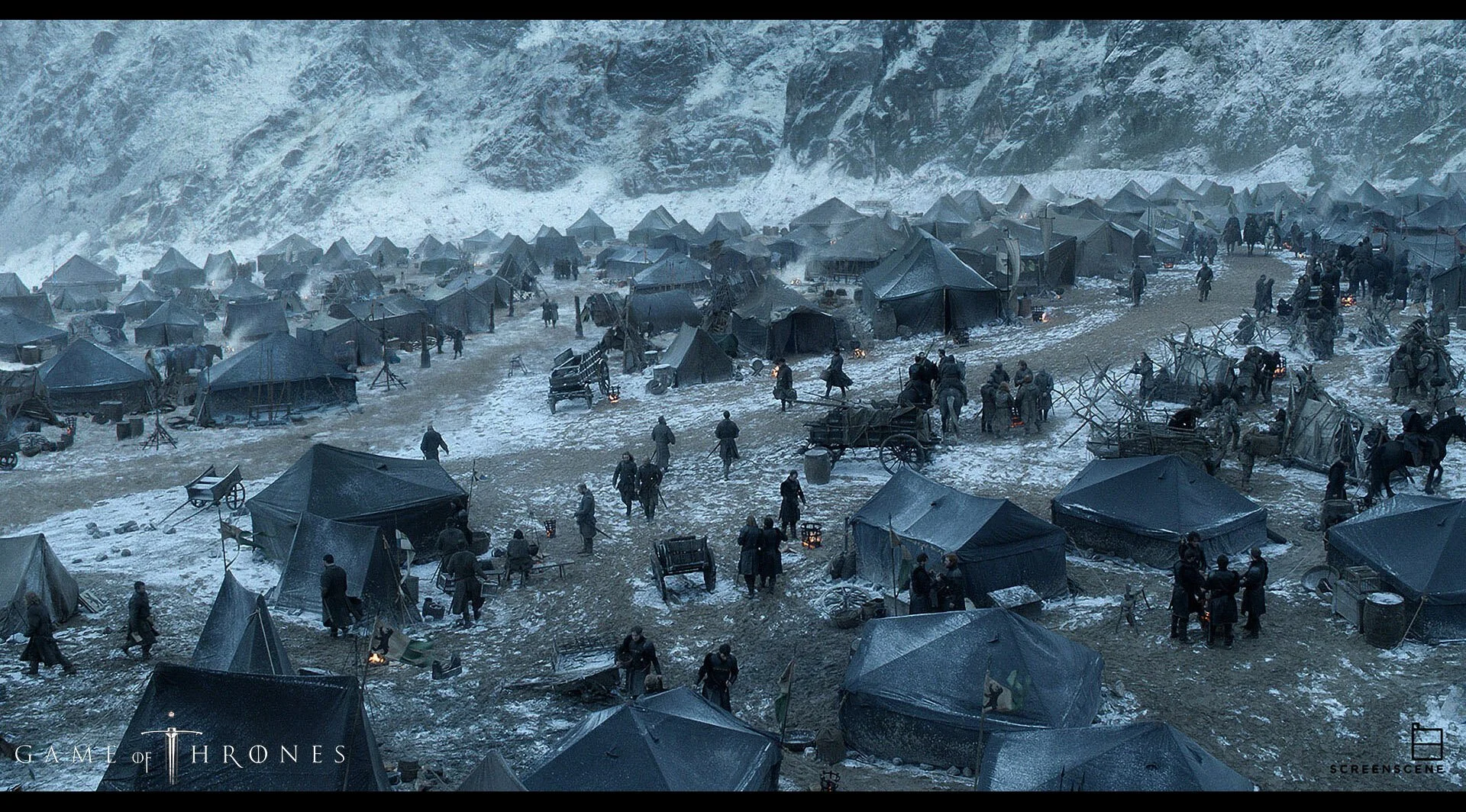 A large scene from Game of Thrones showing a snowy camp with numerous tents, people, carts, and fires in a mountainous setting. Concept Art