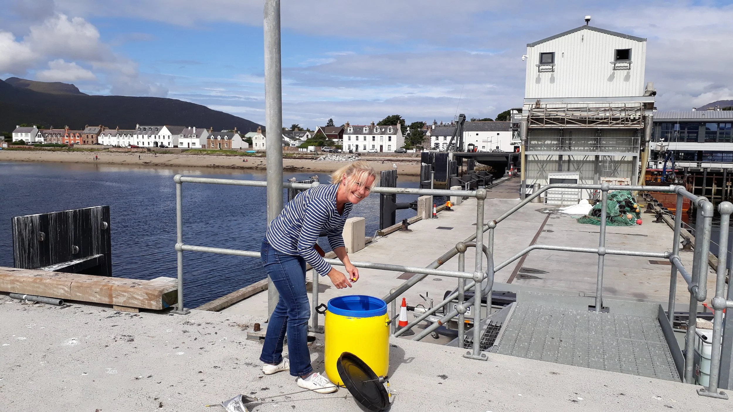 Me (Meg Rodger) installing the Storm Barrel on the end of Ullapool ferry pier for 2 weeks of wind drawing.