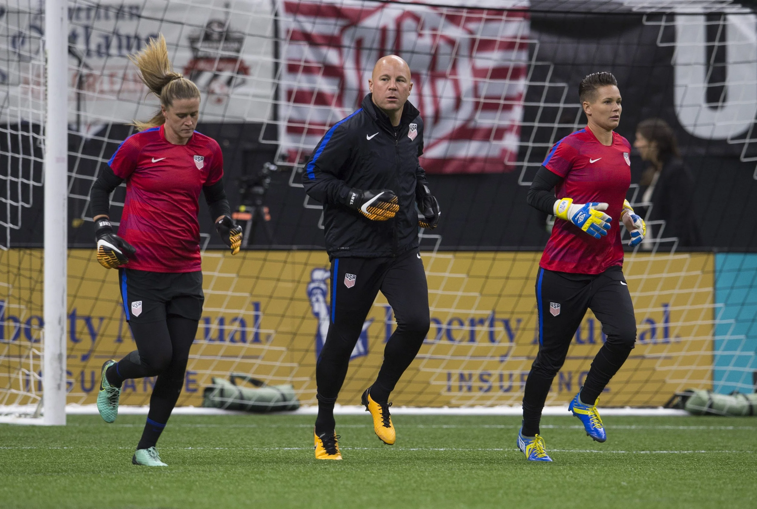 Alyssa Naeher, Ashlyn Harris and USWNT Goalkeeper Coach, Graeme Abel, during warm up.