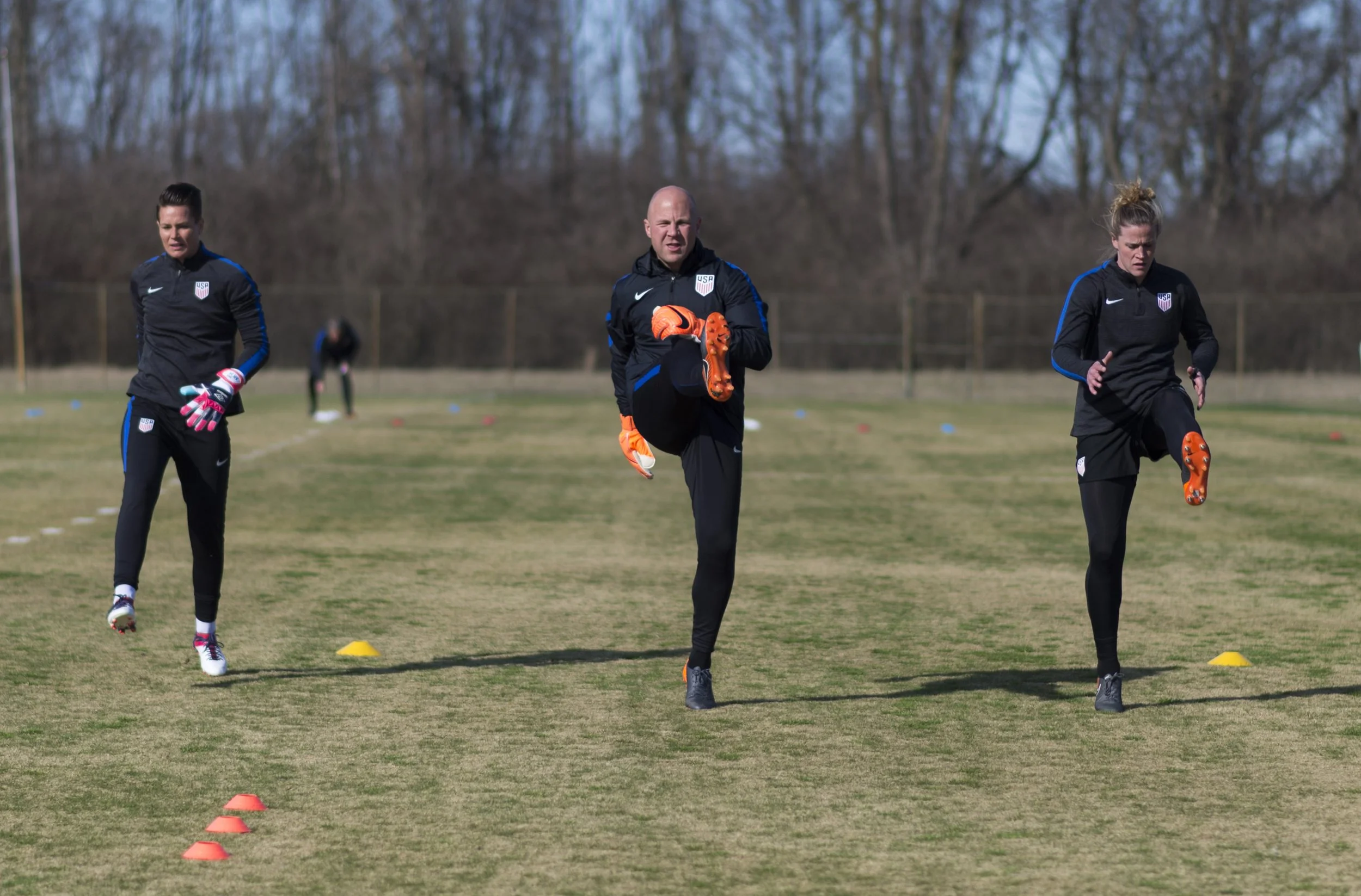 Ashlyn Harris, Graeme Abel and Alyssa Naeher warm up in Columbus, Ohio.
