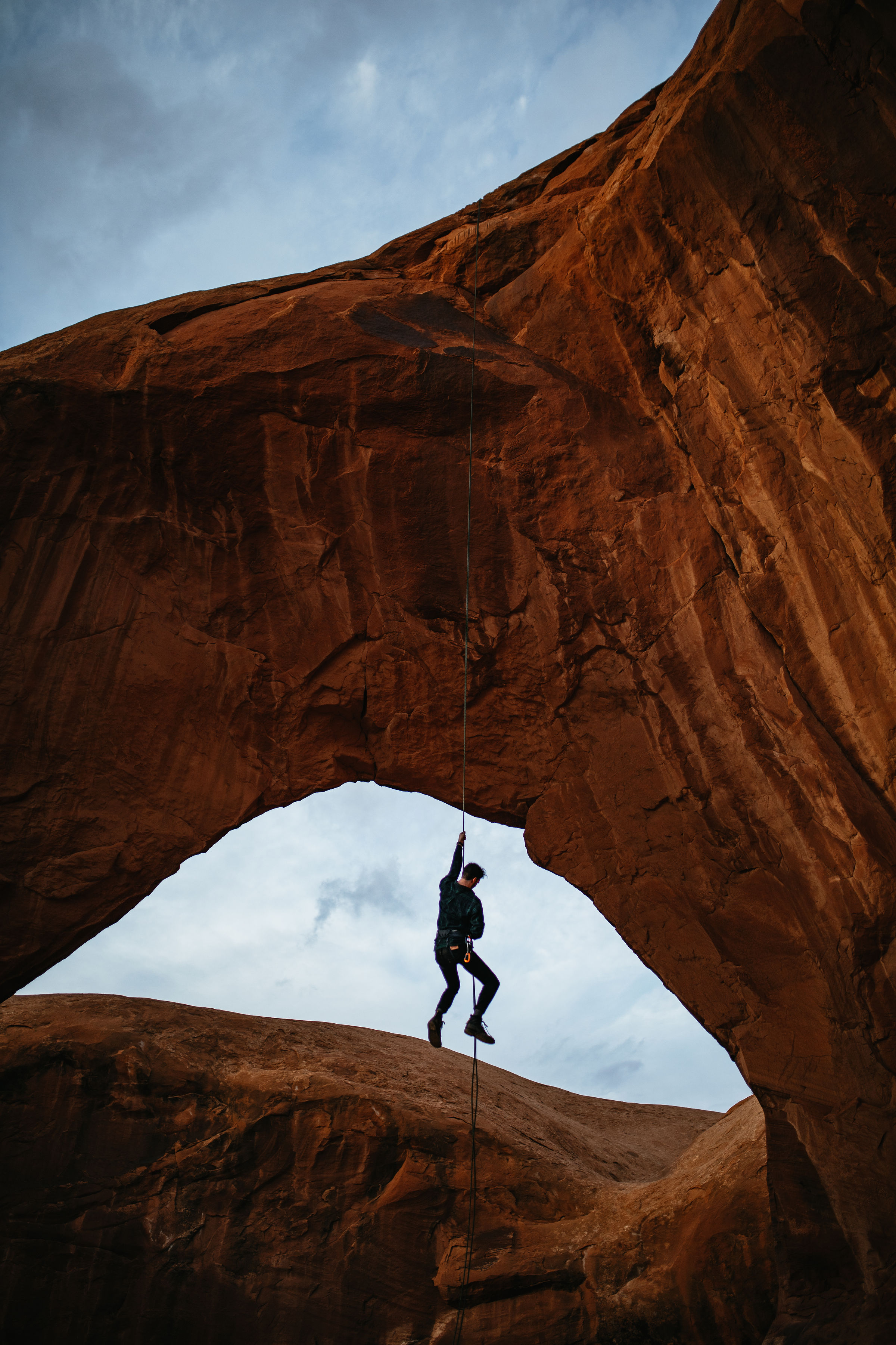 Hanging by a rope in Moab, Utah