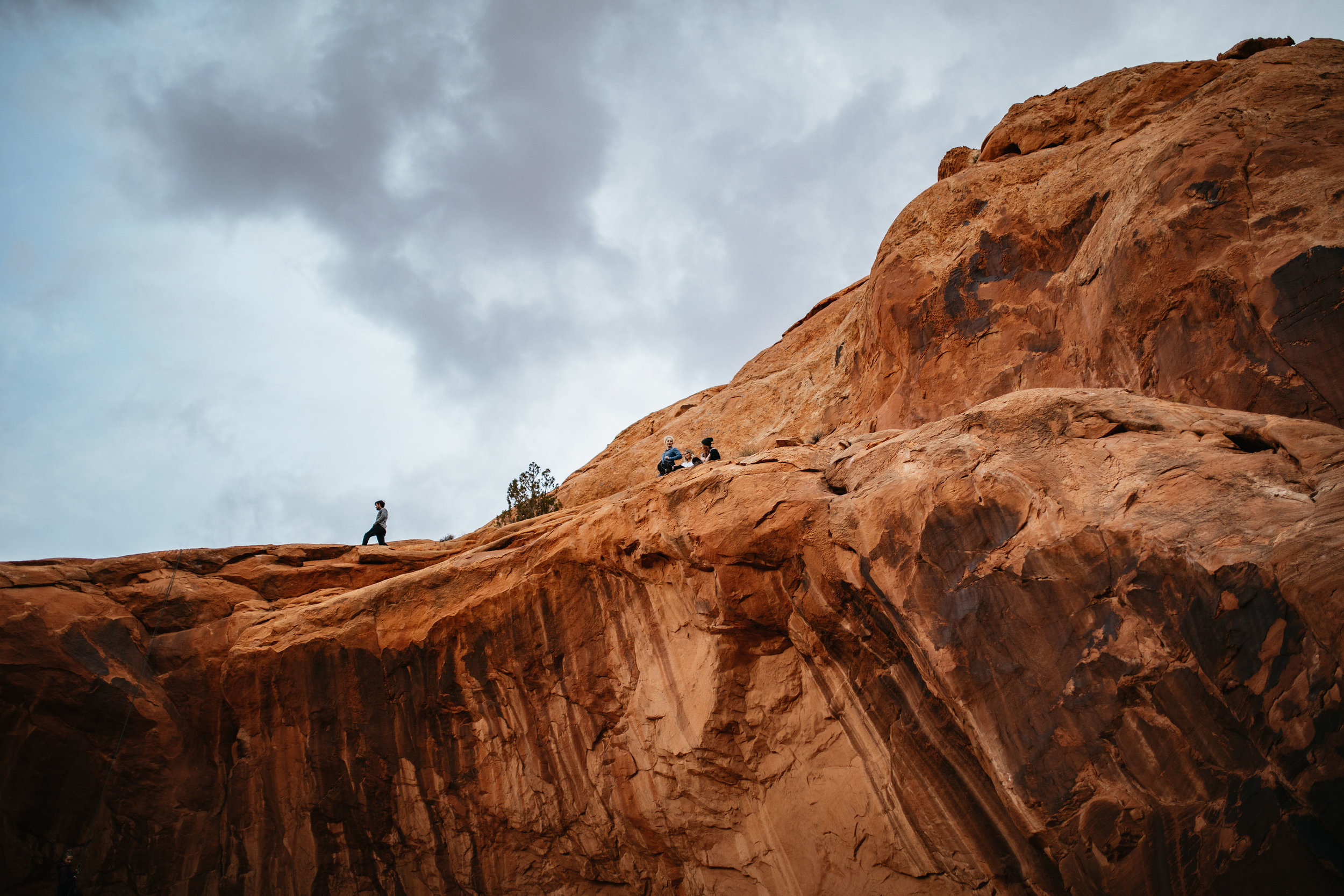 Sitting on a cliff in Moab, Utah