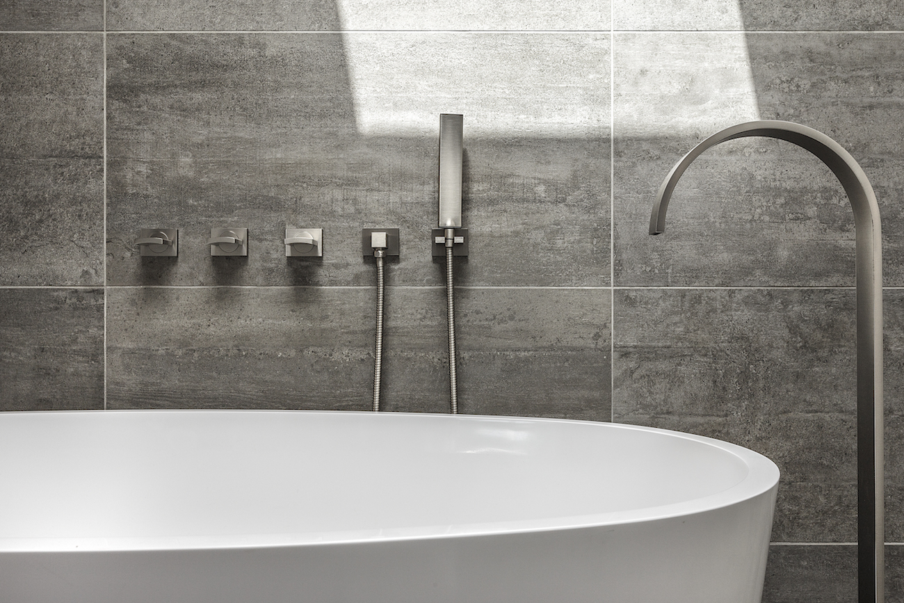 bathroom with white soaking tub and brushed nickel fixtures.jpg