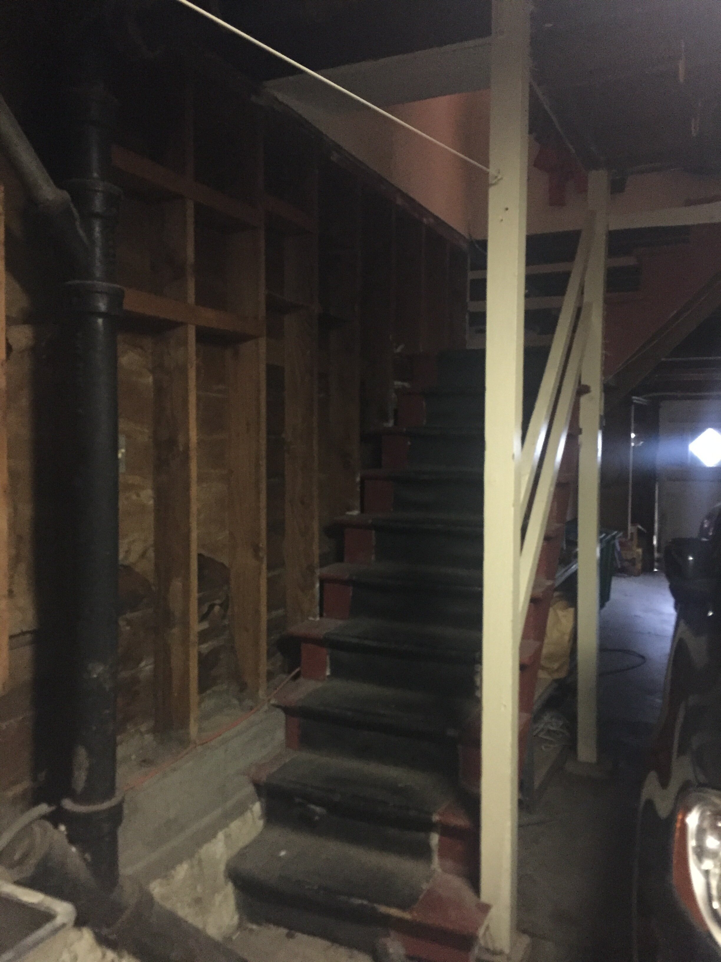 Before: Stairs from garage to second floor