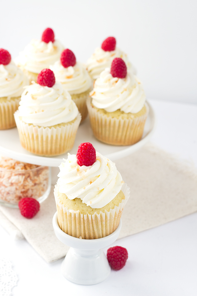Coconut Cupcakes with Raspberry Filling from Cookie Dough and Oven Mitt