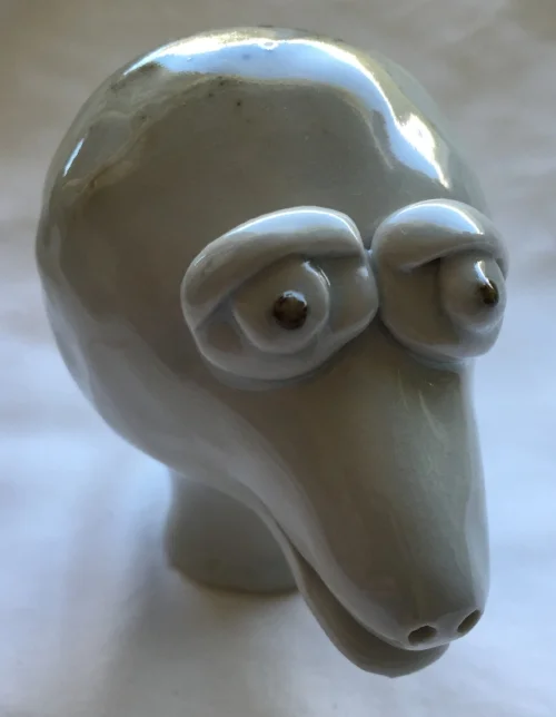 A creature from a period of time I was failing in high fire. Most of the work fired during this time was ruined due to incompatibility with the studio's clear glaze and the clay body being used. 