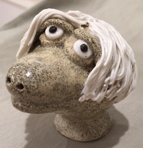 Mid Fire Freckle Clay (just bought 100 pounds!) and porcelain hair. 