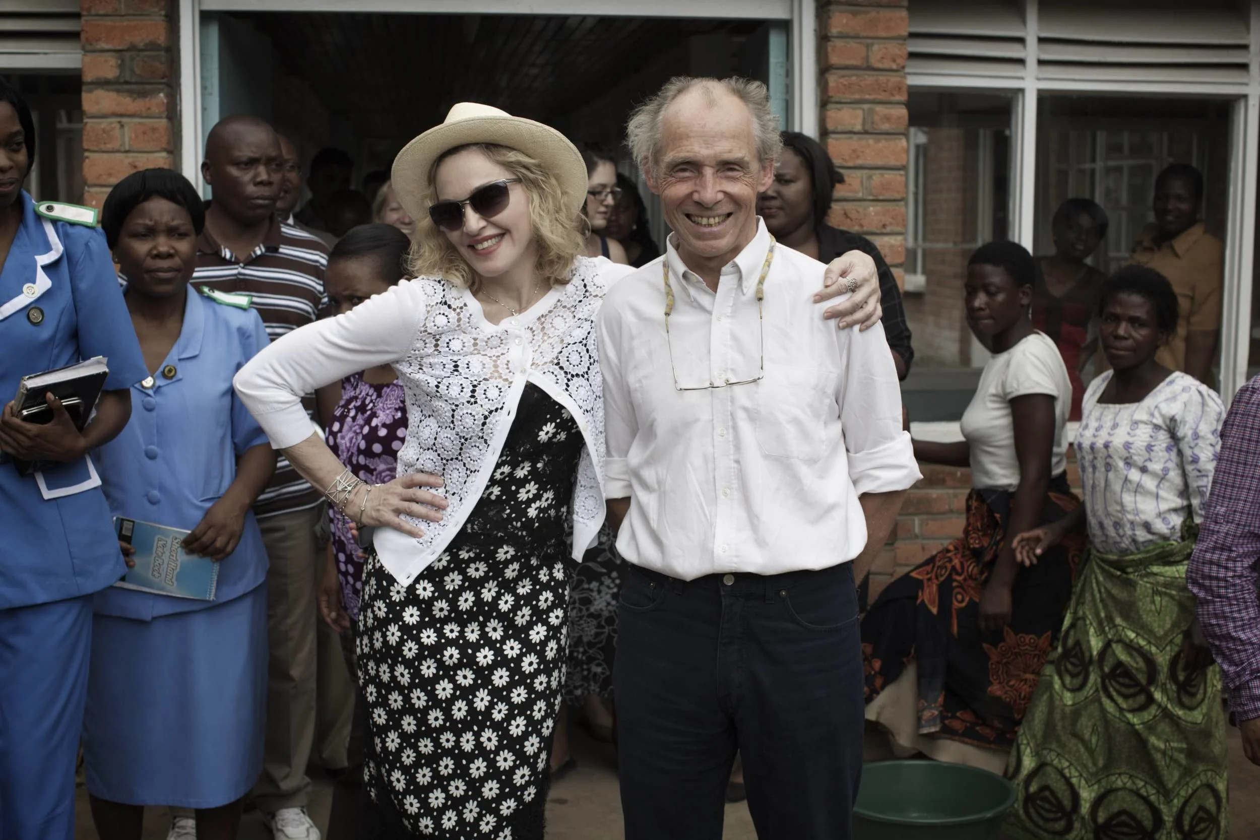Madonna and Dr. Eric Borgstein, Chief of Pediatric Surgery at Queen Elizabeth Hospital. November 2014