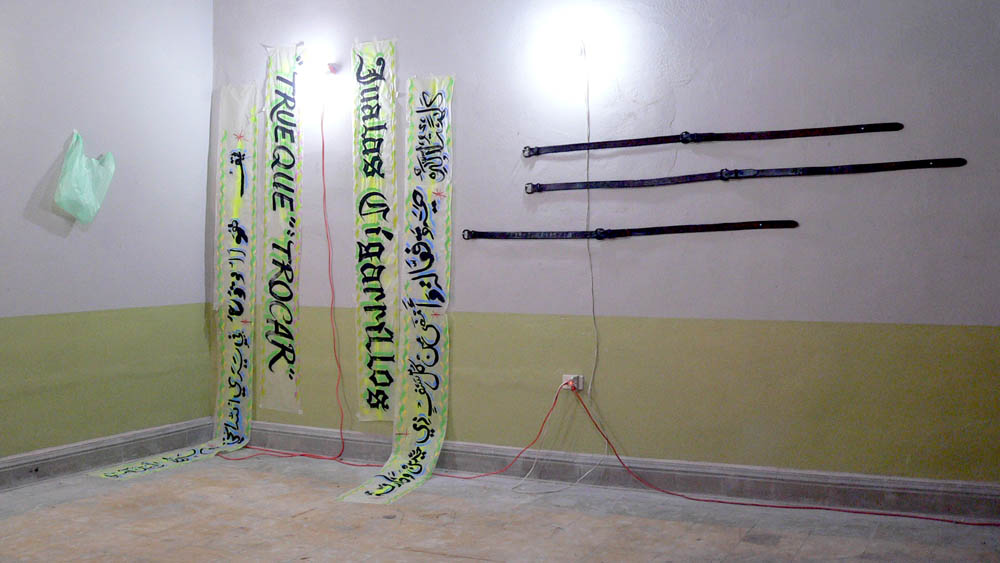 Jualas Cigarillios/Trueque Trocar/Flour Tortillas and God, Acrylic and enamel on wax paper, plastic bag with inflated balloon fluorescent lighting fixtures and extension cords, Stamped leather belts, 2007