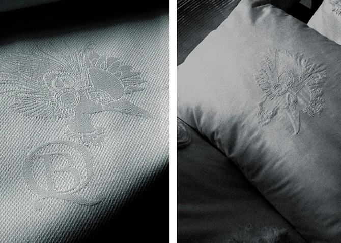 Logo embroidered on pillow cases & napkins.