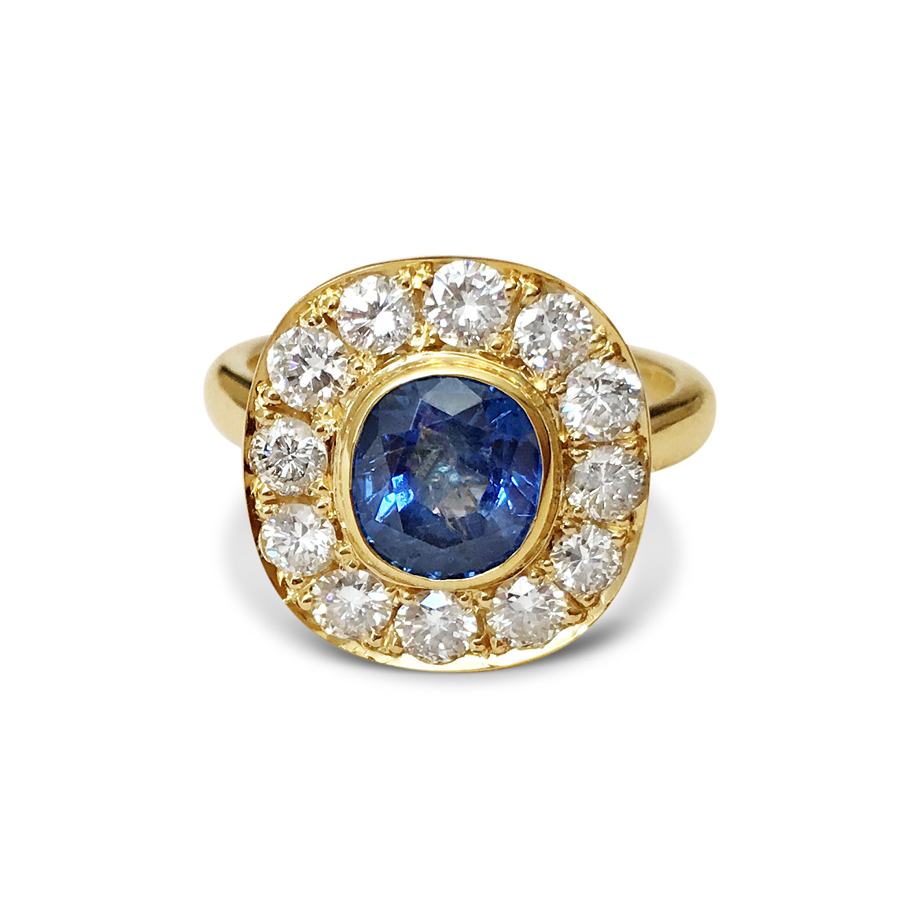 Sapphire-and-diamond-cluster-engagement-ring-in-yellow-gold.jpg