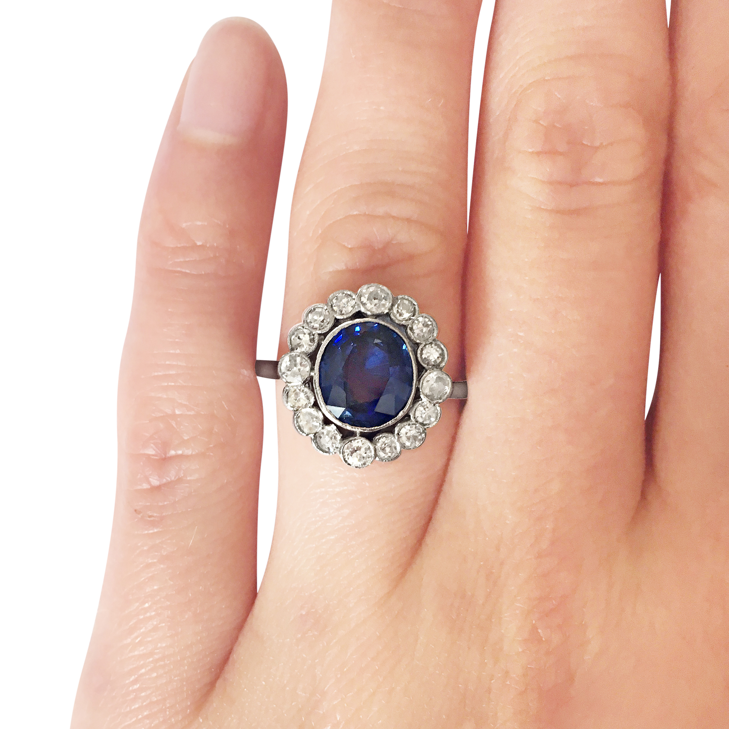 sapphire & diamond halo ring hand shot