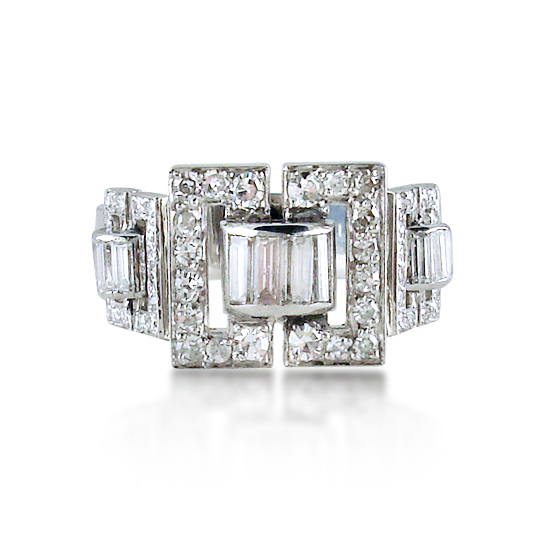 brilliant-and-baguette-cut-diamond-buckle-ring-mounted-in-platinum.jpg