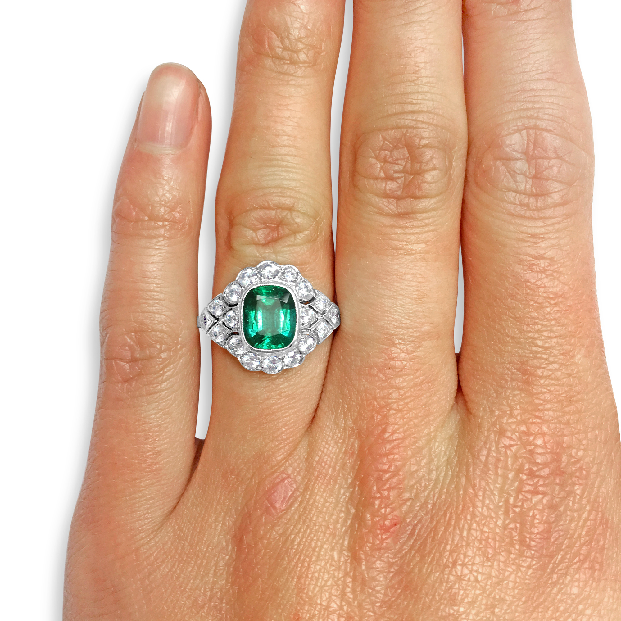 Cushion-cut Emerald ring hand shot