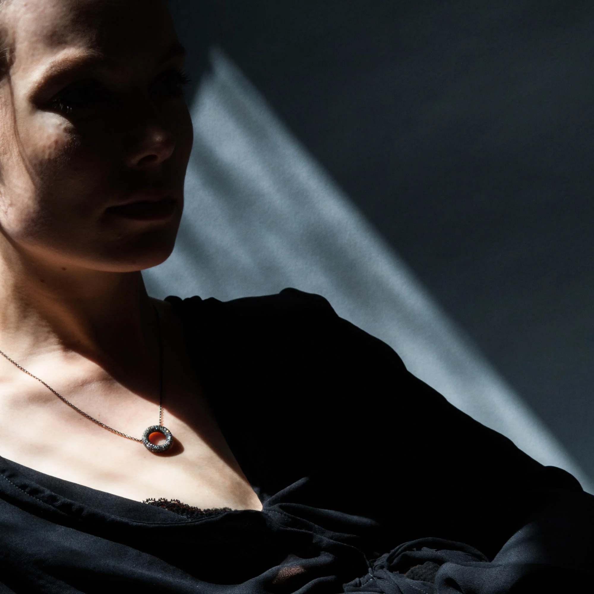 Black and white diamond polo pendant model 1