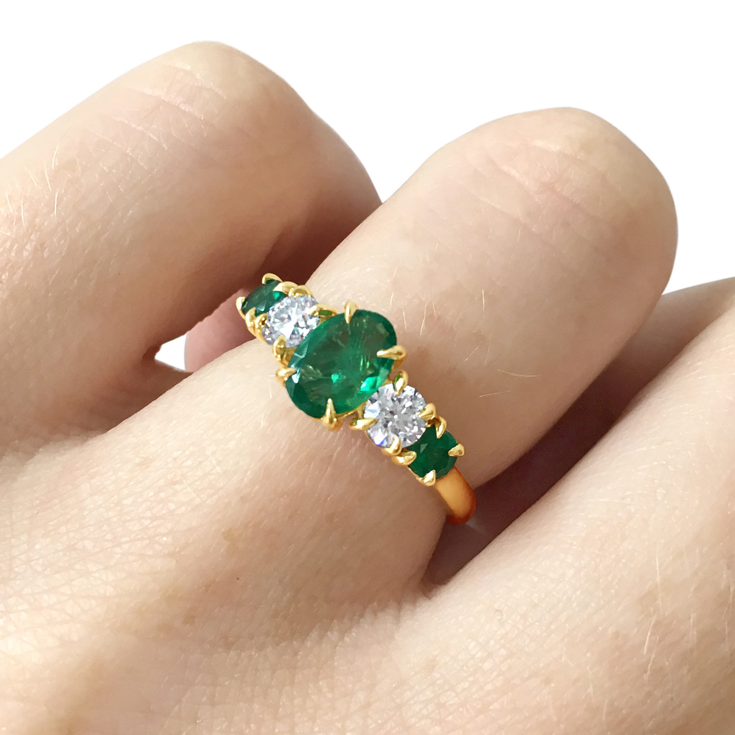 Bespoke emerald and diamond claw-set five-stone ring, mounted in 18ct yellow gold side