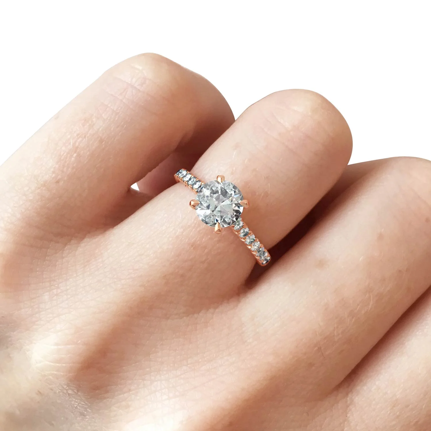 Bespoke diamond solitaire ring with four talon-shaped claws and diamond fishtail half-set band, mounted in 18ct rose gold hand