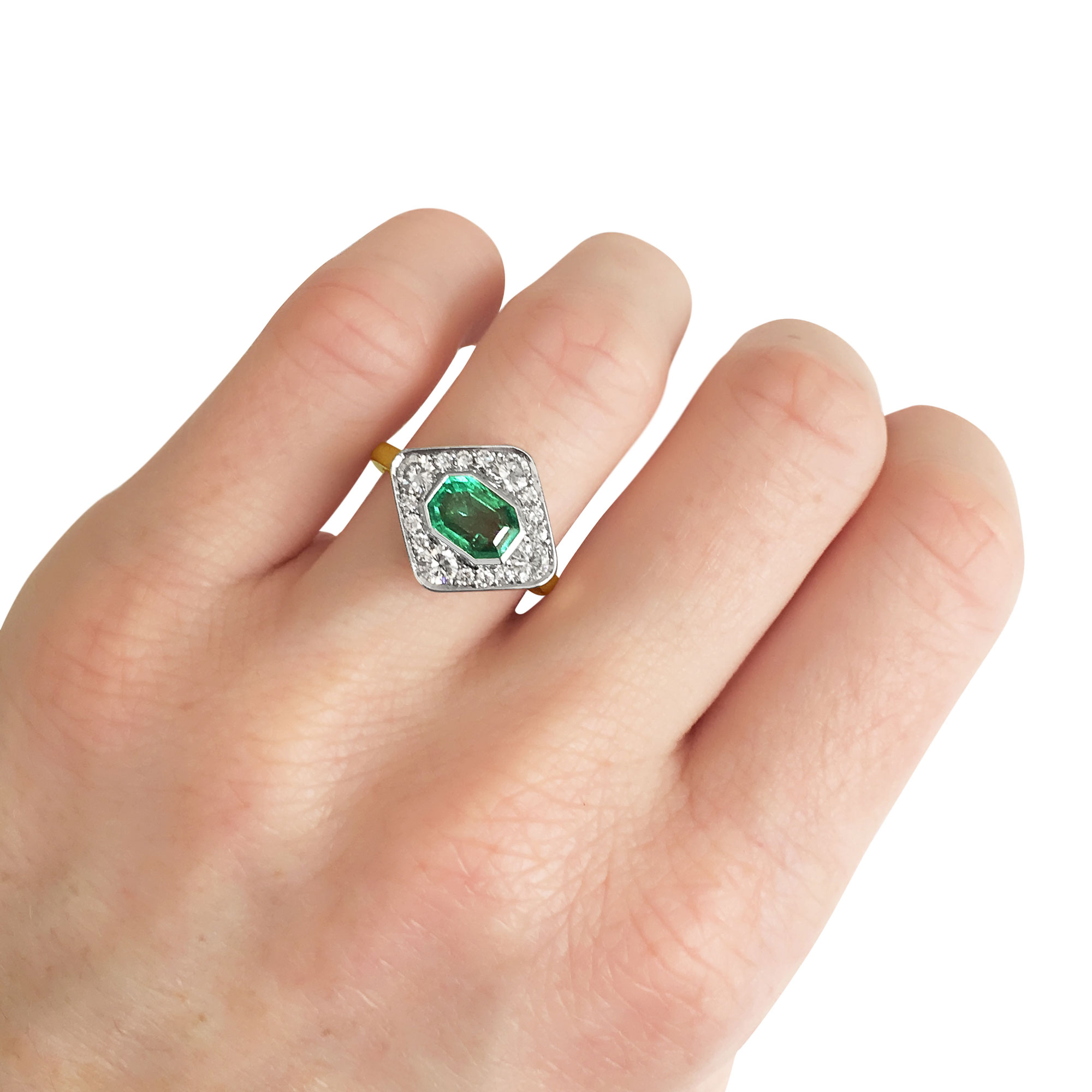 Emerald and diamond panel ring mounted in 18ct white and yellow gold on hand side