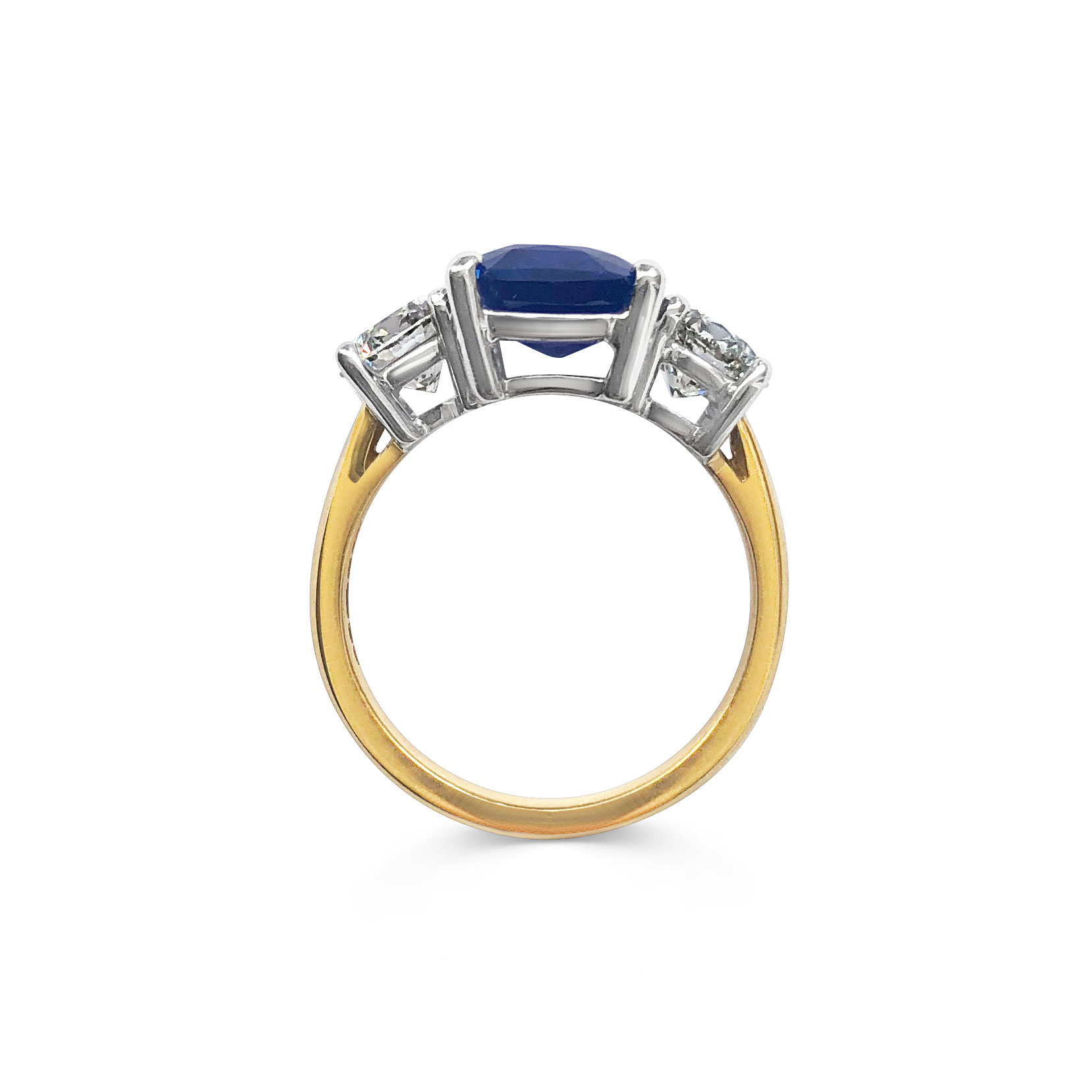 Emerald-cut Sapphire and diamond three stone ring set in 18ct yellow gold.