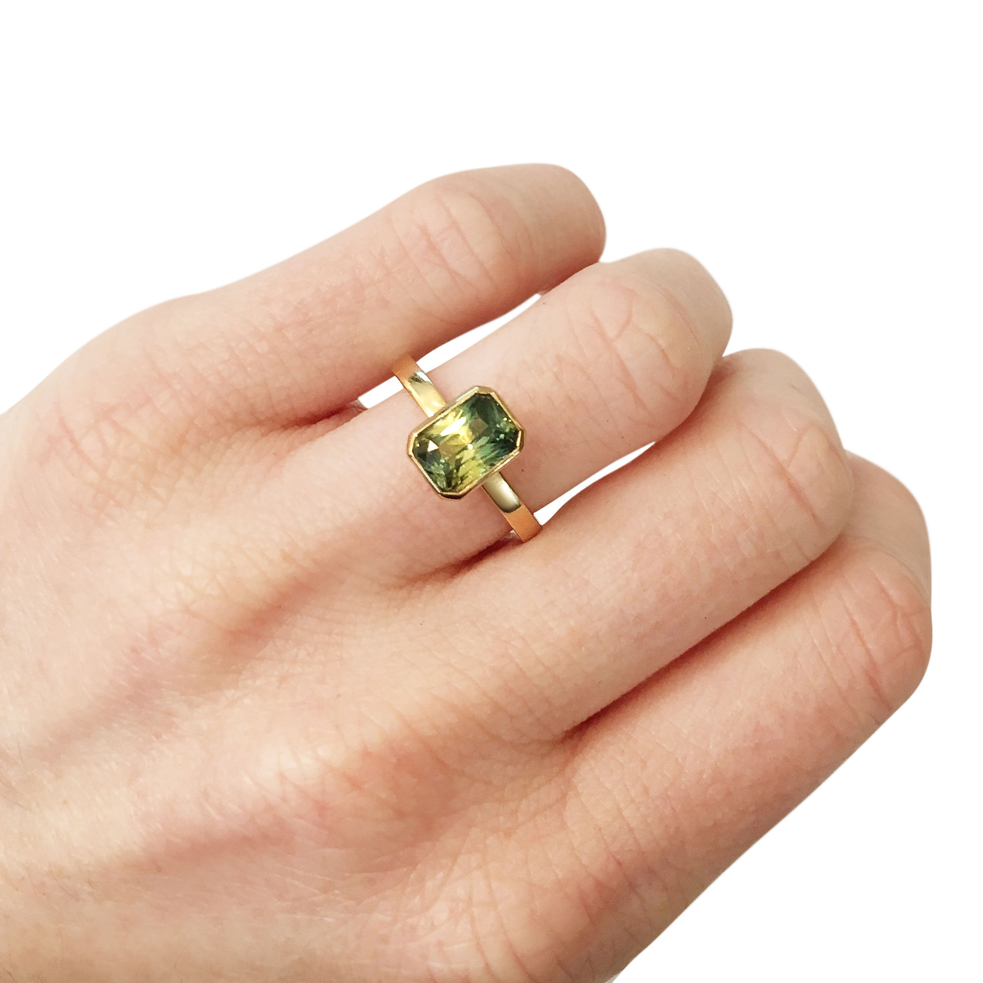 Emerald-cut parti sapphire ring hand