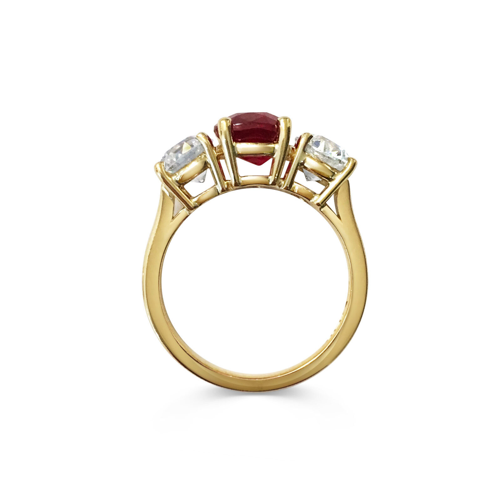 Ruby and Diamond three-stone ring mounted in 18t yellow gold. 