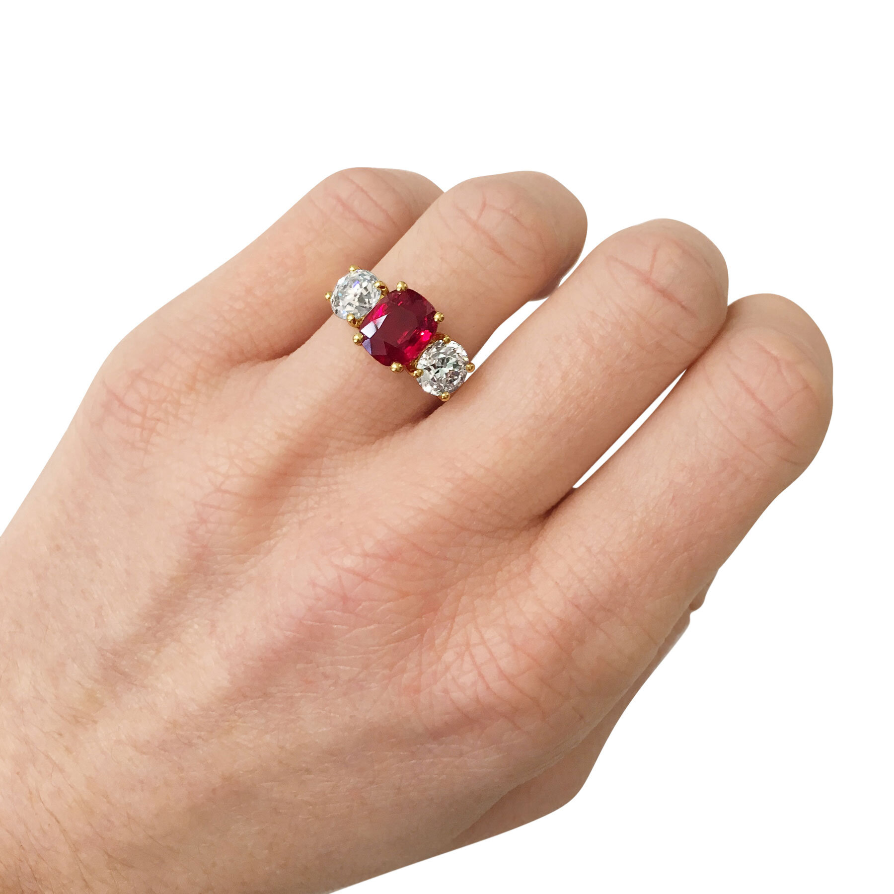 Ruby and Diamond three-stone ring mounted in 18t yellow gold. 