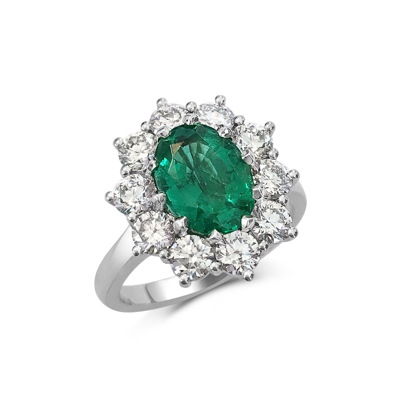 Oval emerald with diamond halo engagement ring, mounted in platinum. 