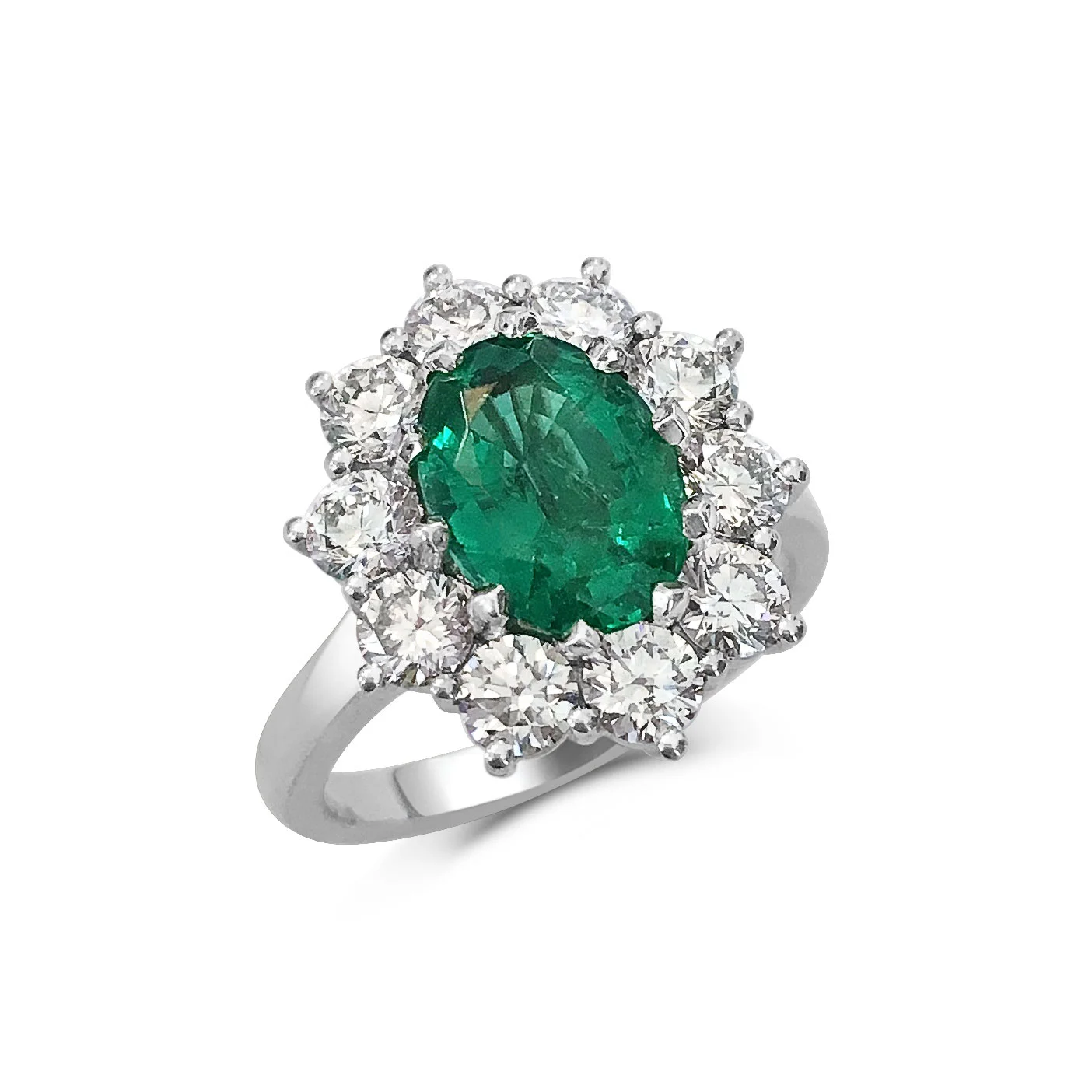 Oval emerald with diamond halo engagement ring, mounted in platinum.