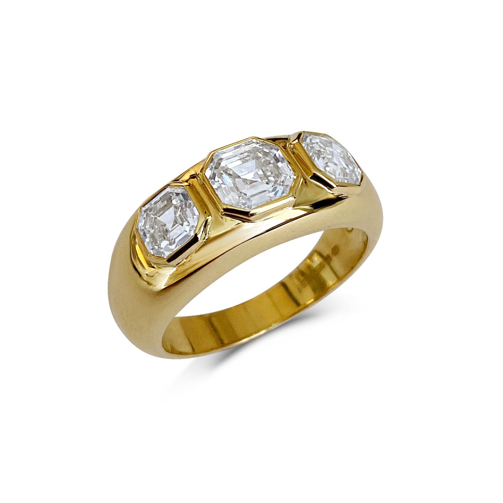 Three-stone Asscher-cut diamond gypsy ring mounted in 18ct yellow gold