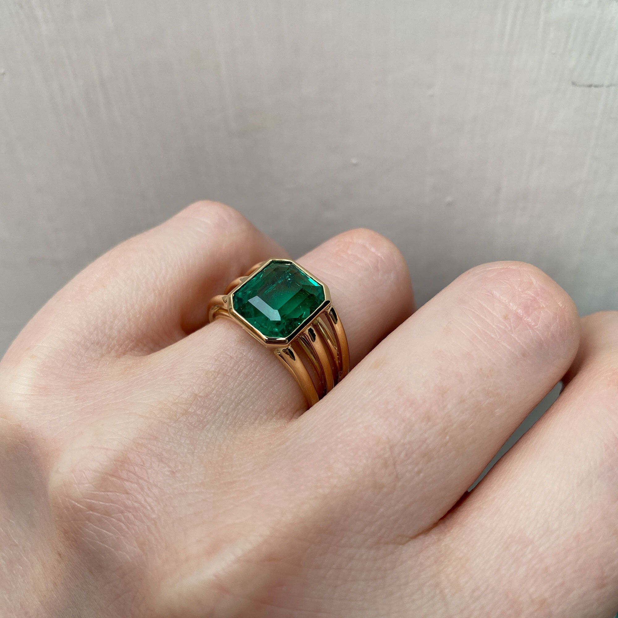 Emerald-three-row-ring-on-finger.jpg