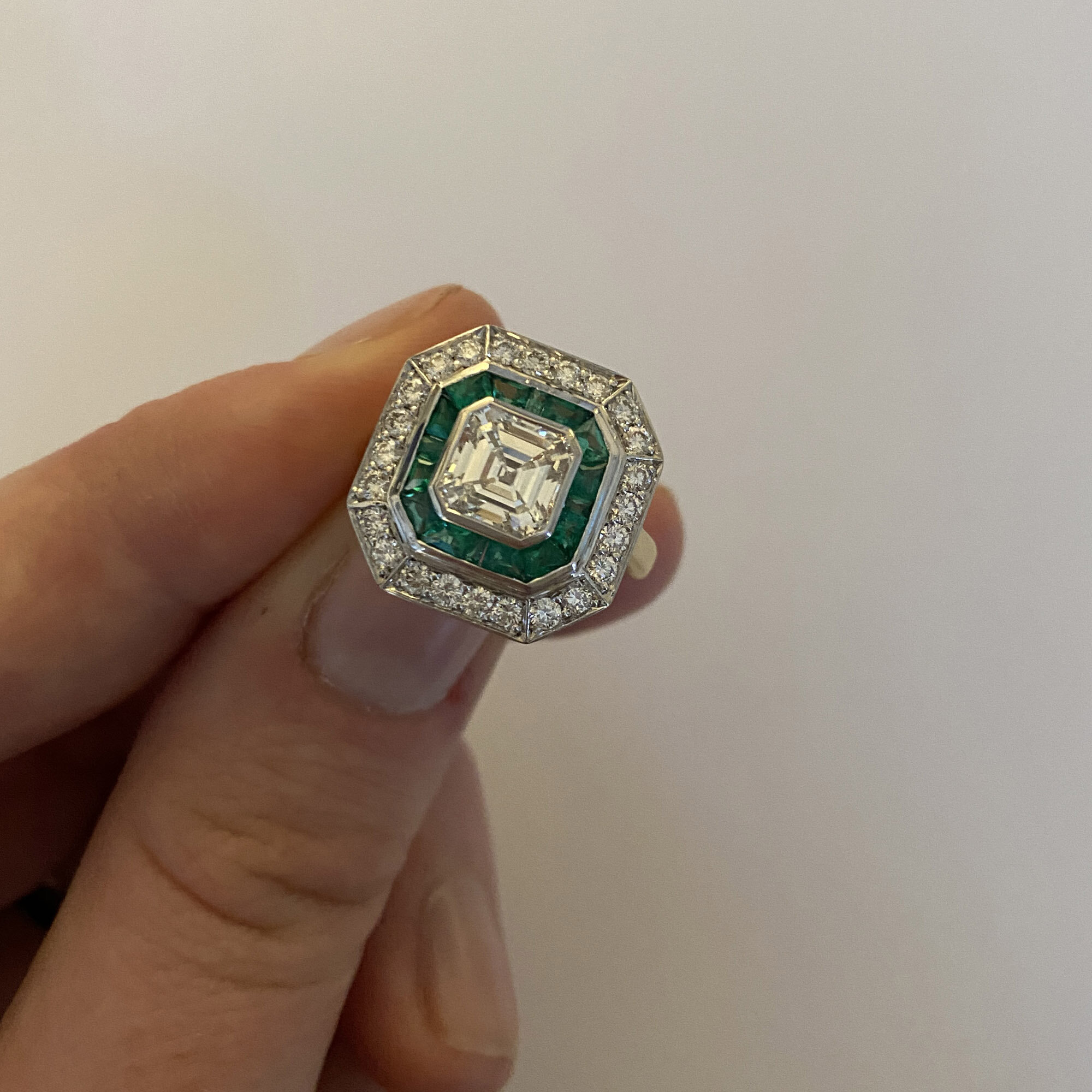 Emerald & diamond two-row target ring on.jpg