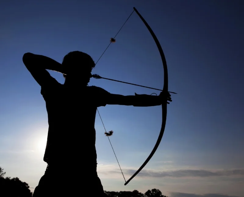  Pulling back the bowstring. 