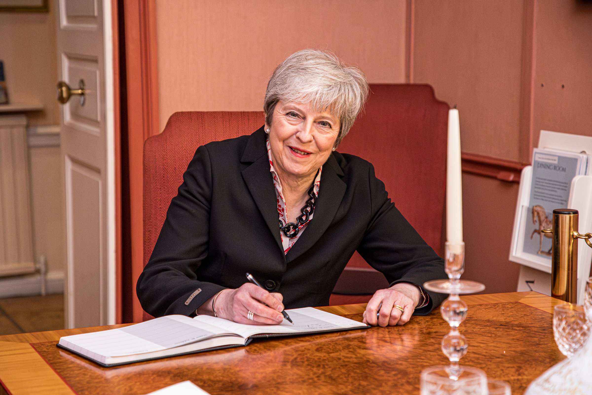  Former Prime Minister Theresa May, signing the visitors book at Arundells during her recent visit 