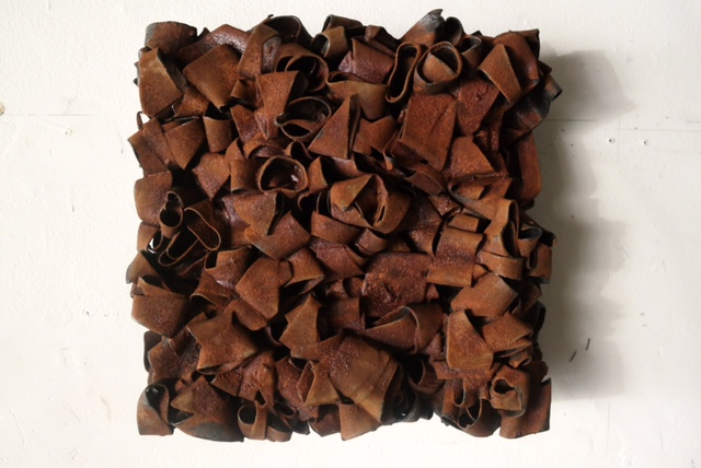 "Designer Rust" - iron powder, rubber, 12 x 12 x 3 inches (2017)