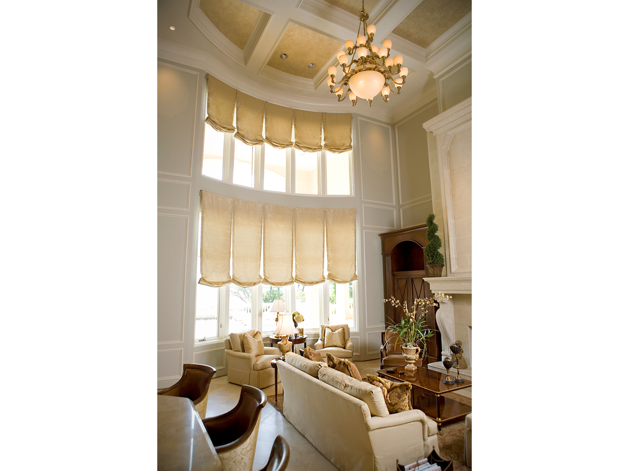 Interior photo of living room with 2 story windows