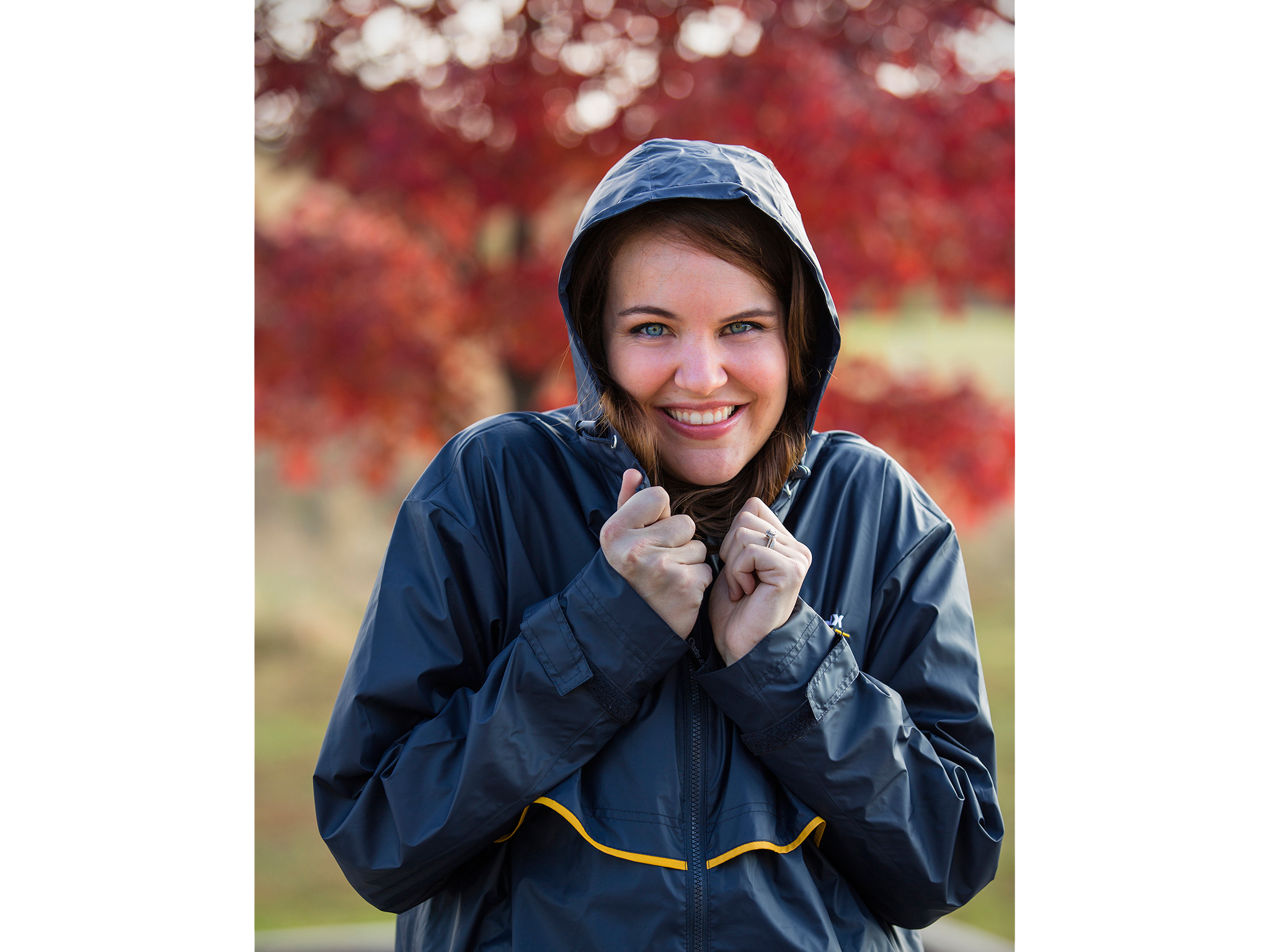 Fall shot of woman in raincoat for promotional products catalog