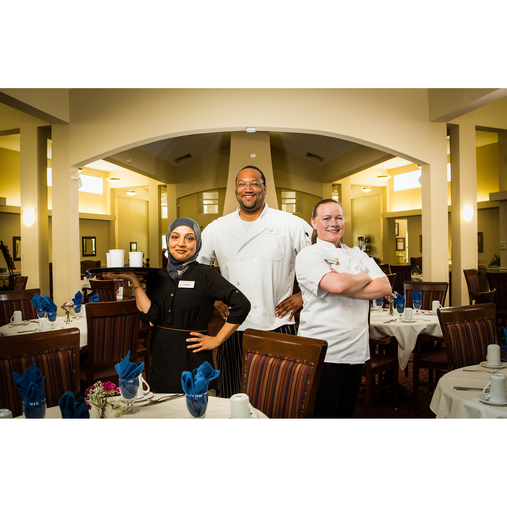 Portrait of restaurant server and chefs