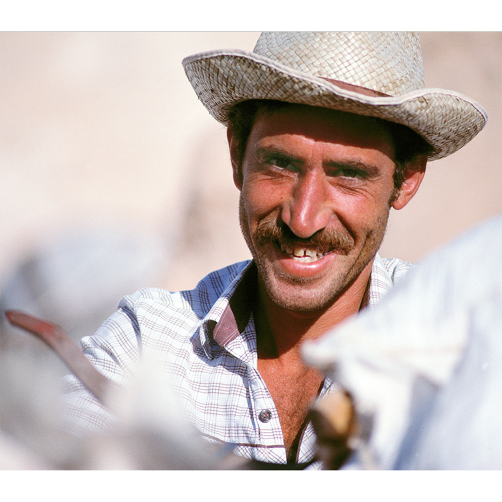 Portrait of Greek man in hat with horse by Craig Anderson Photography