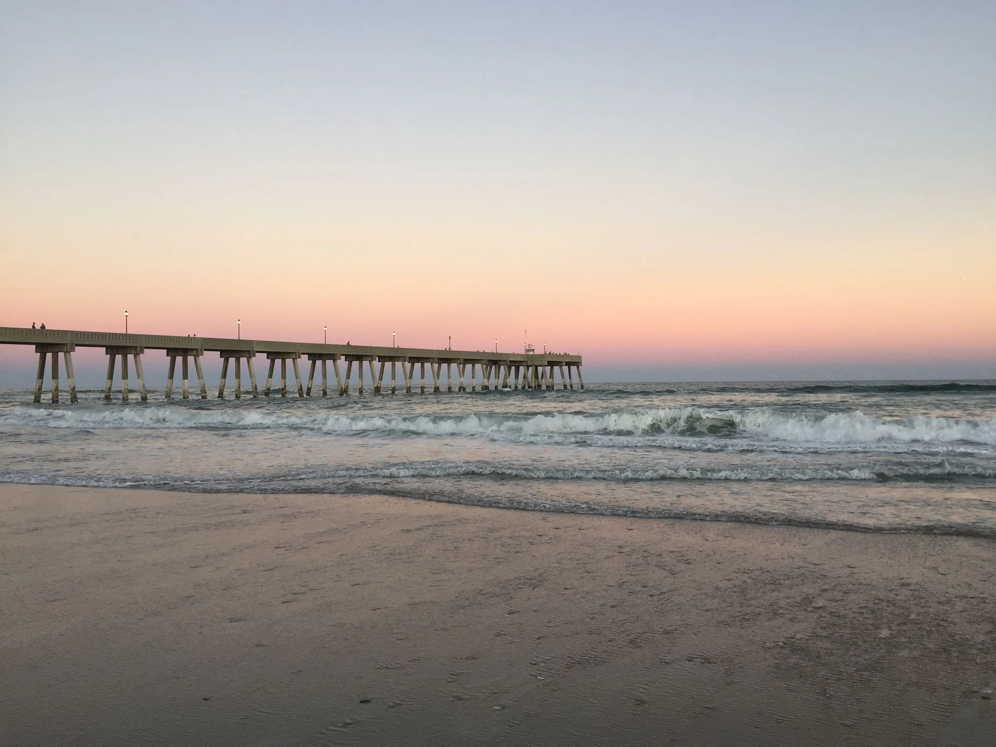  A little over a year ago, I packed my life up and moved to a place I have always wanted to live with a person I believed I would spend my life with. I quit the job that drove me insane and committed myself to writing. When I took this photo, I was reminded about the wonder of the ocean when the sun dips under the horizon. I was reminded of what it felt like to feel alive. Living in North Carolina, with the person I thought would be my husband, turned out not to be something for me. Call it poor timing, call it jumping in head first and drowning, call it being stupid and foolish. But if I took anything home from that experience it was standing with my toes in the sand marveling at that beautiful sunset, listening to the waves kiss the shoreline. I felt alive, and that is a damn good little victory.