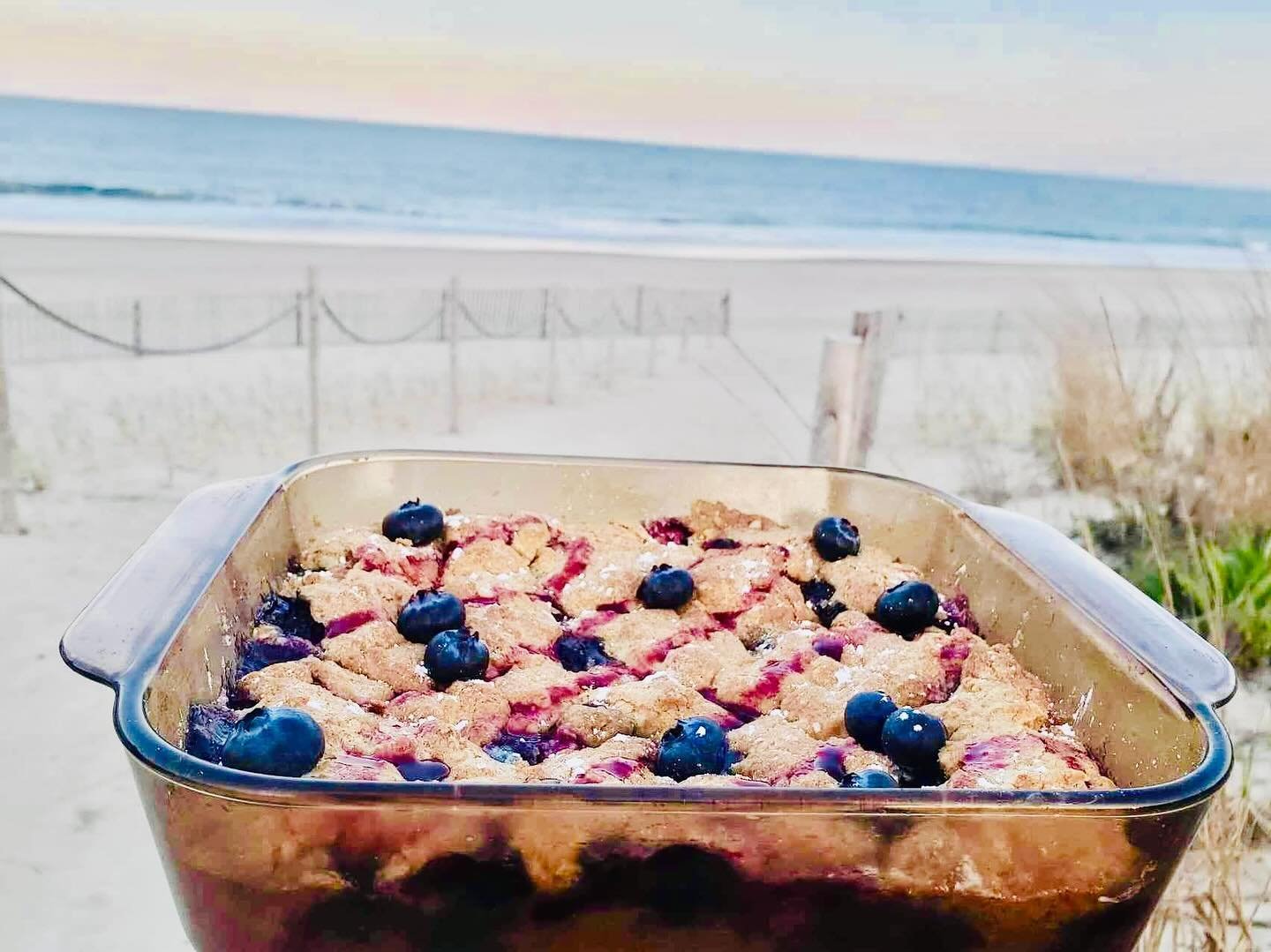 Our famous Blueberry Buckle Cake. Fresh Blueberry Sauce. Made in house. Available for  purchase via our website and pick-up at Sedona between 5:00pm - 7:00pm. Our address is 26 N Pennsylvania Ave Bethany Beach, DE 19930. Click the link in our bio.