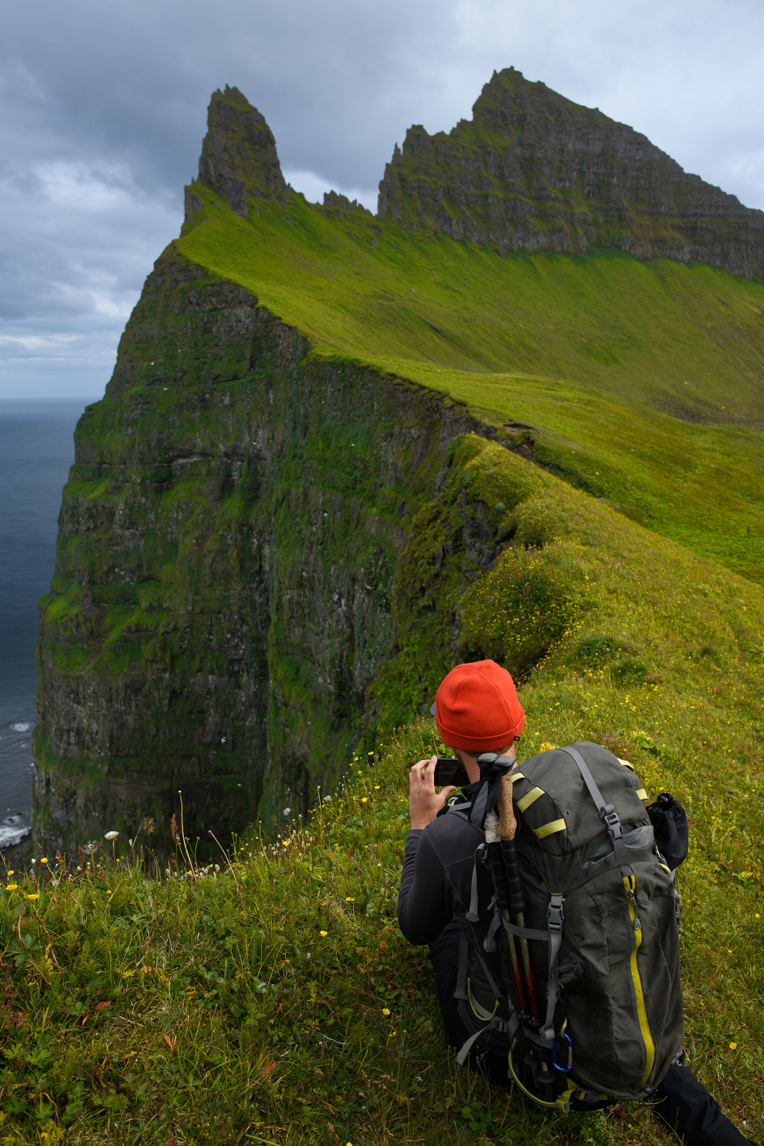 Brendan taking a photo of the cliff, 2022