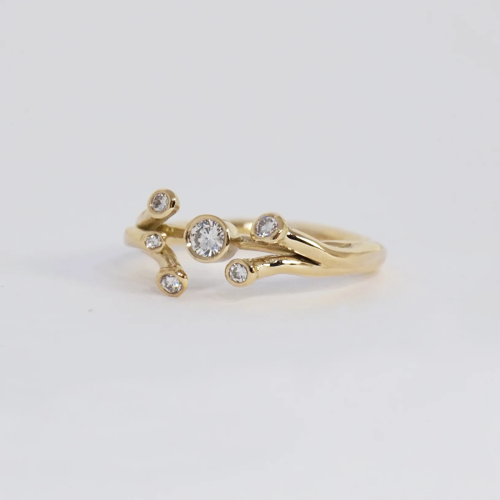 Golden ring with recycled diamonds