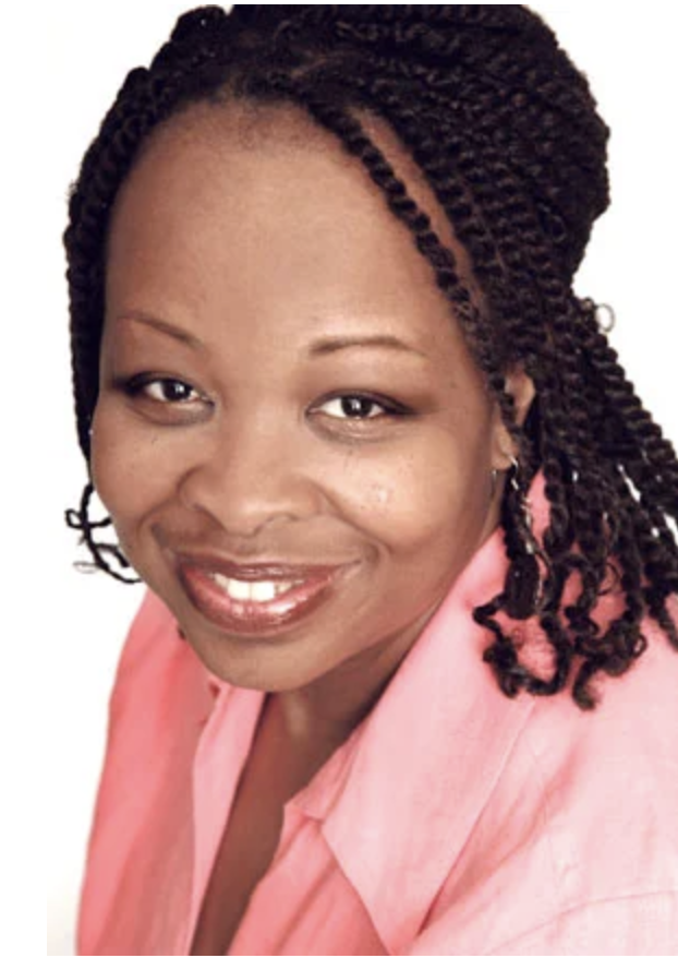 Color image WIlliams-Garcia in pink collar shirt smiling