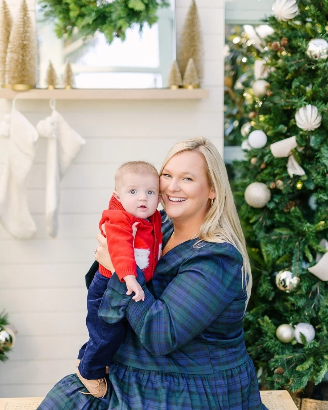 All smiles because Christmas is coming soon 🎄
I absolutely loved the mint greenhouse paired with the greenery and oversized golden jingle bells &mdash; such a festive, timeless backdrop. And baby&rsquo;s first Christmas? Truly the sweetest season to