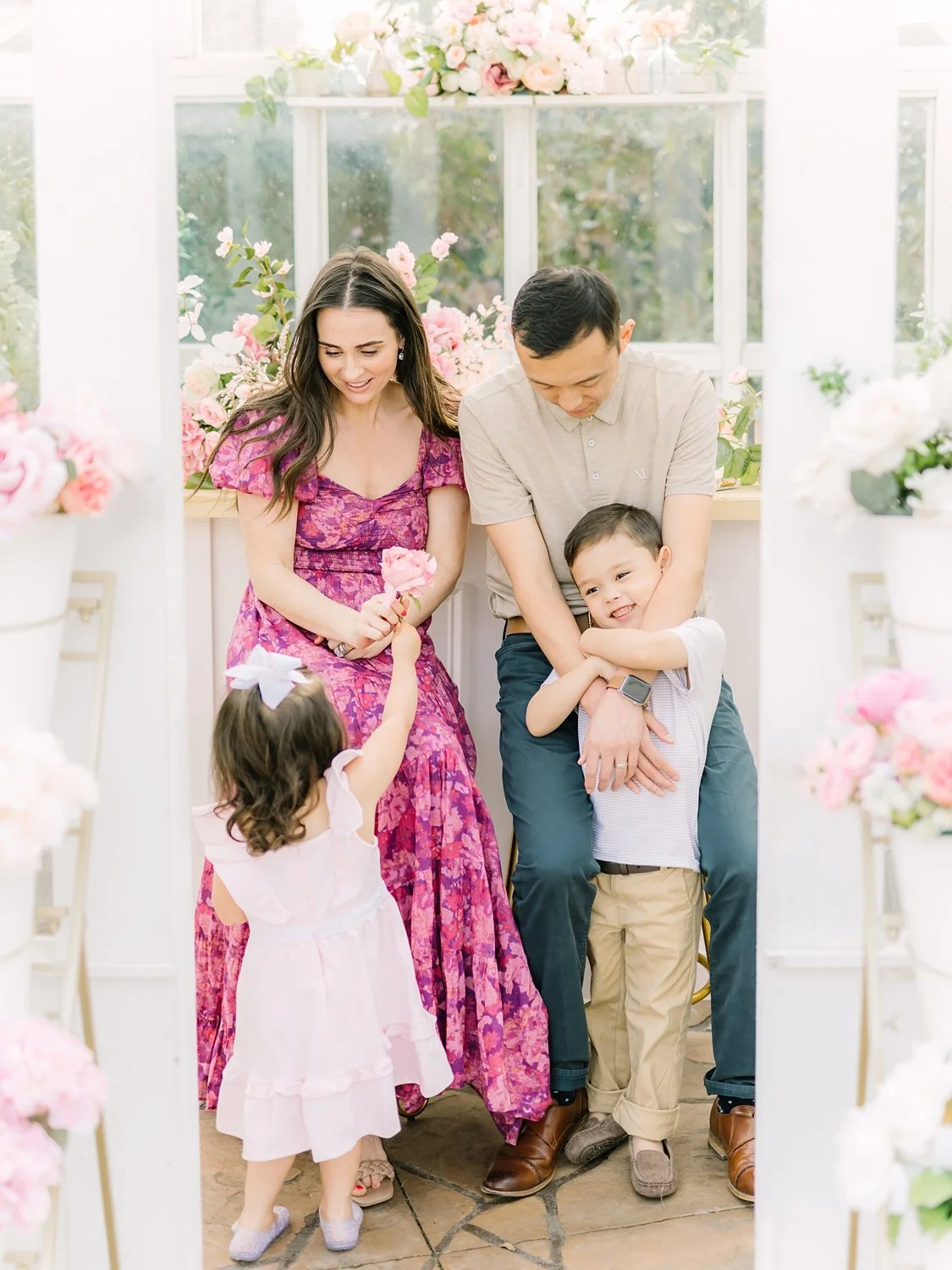 family at a mckinney greenhouse with flowers