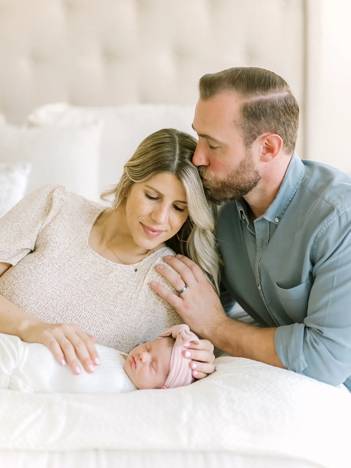 new parents with newborn baby at home