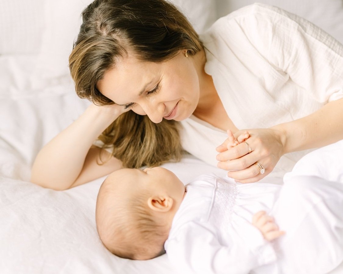 mom with newborn baby at home for newborn photoshoot