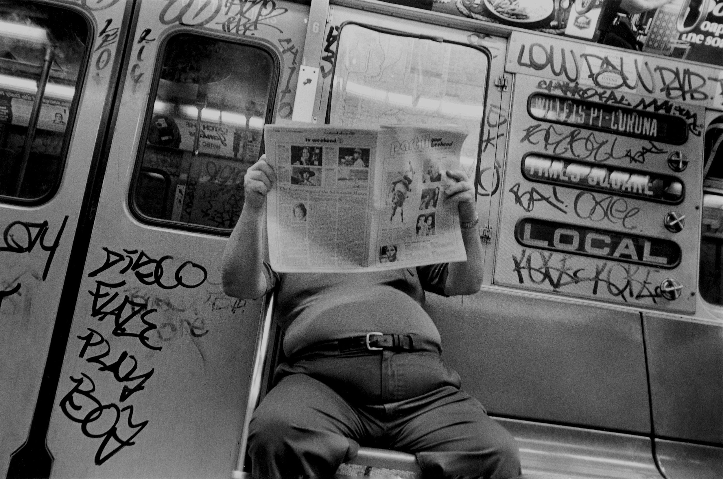 chubby guy reading paper, nyc, early 1980’s